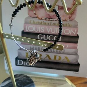 Elegant Black Beaded Bracelet with Silver Charm